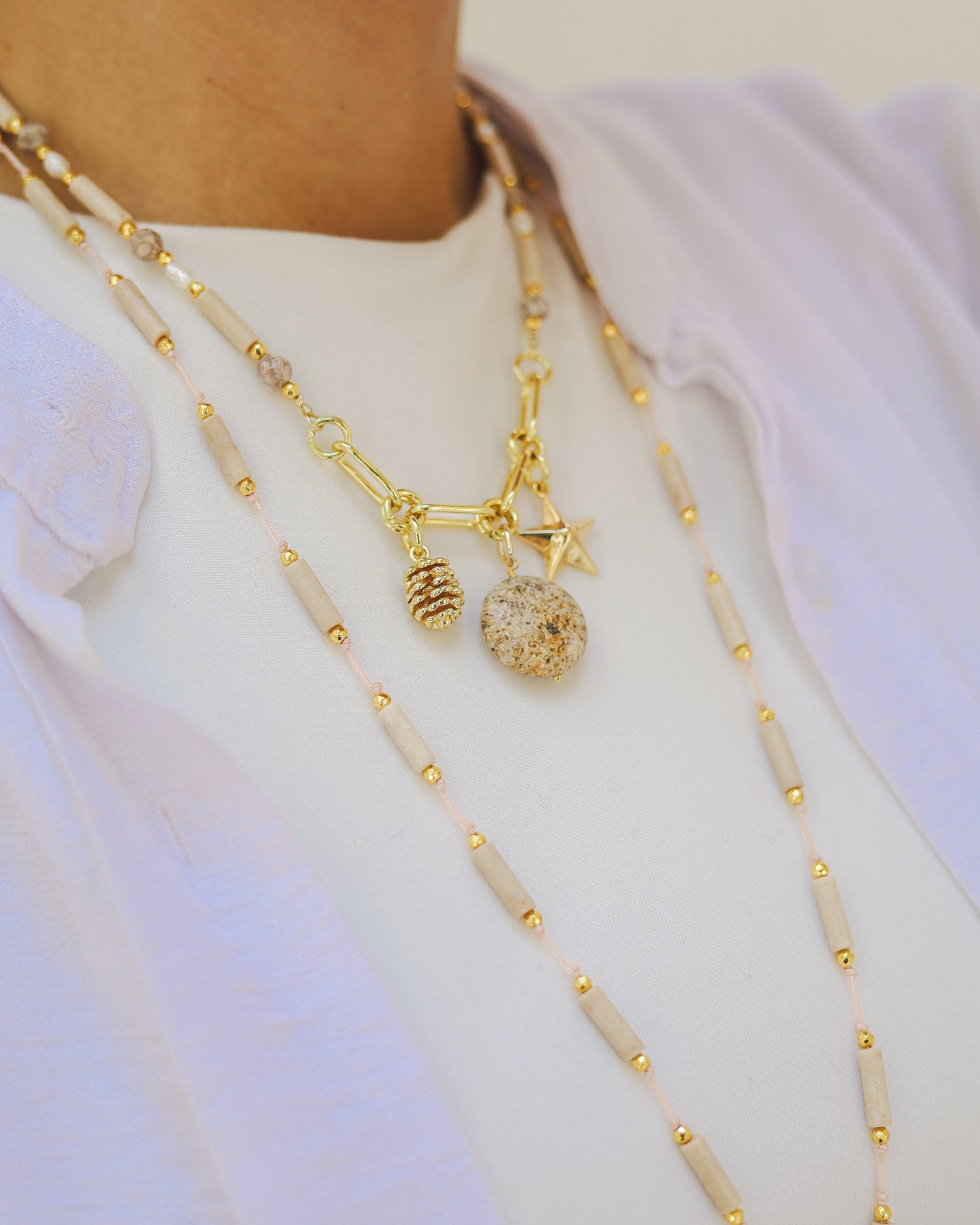 Nude stones necklace with golden charms