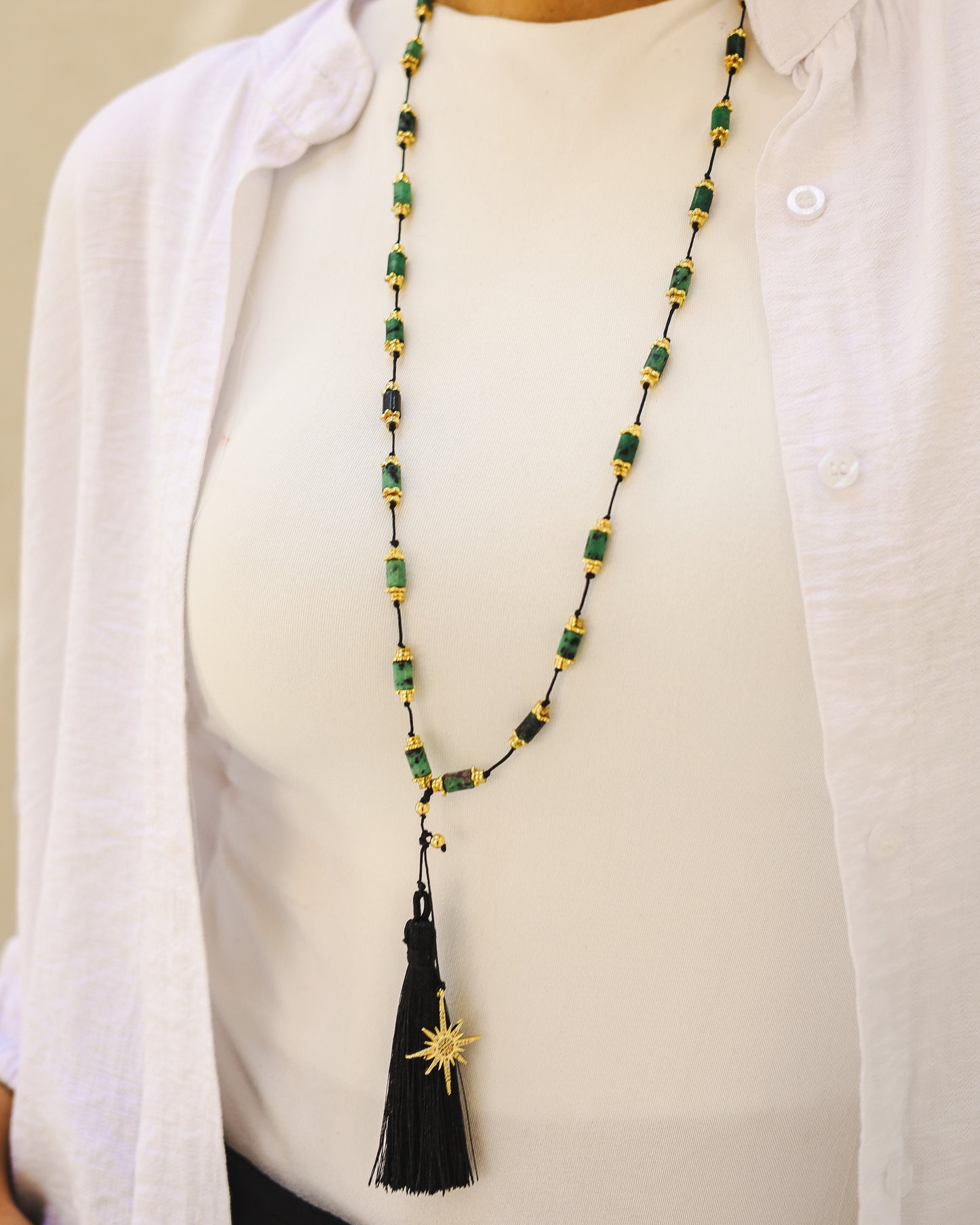 Black tassel with green stones